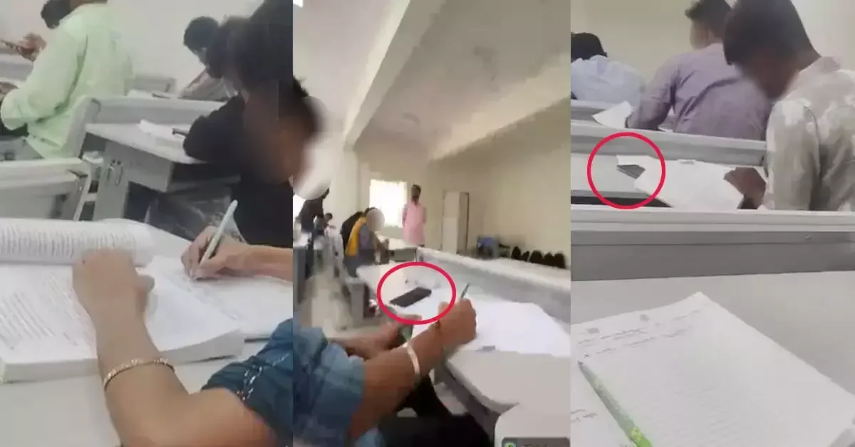 Students inside an examination hall in Shivamogga, where books and a mobile phone were seen on desks during the KSOU exams