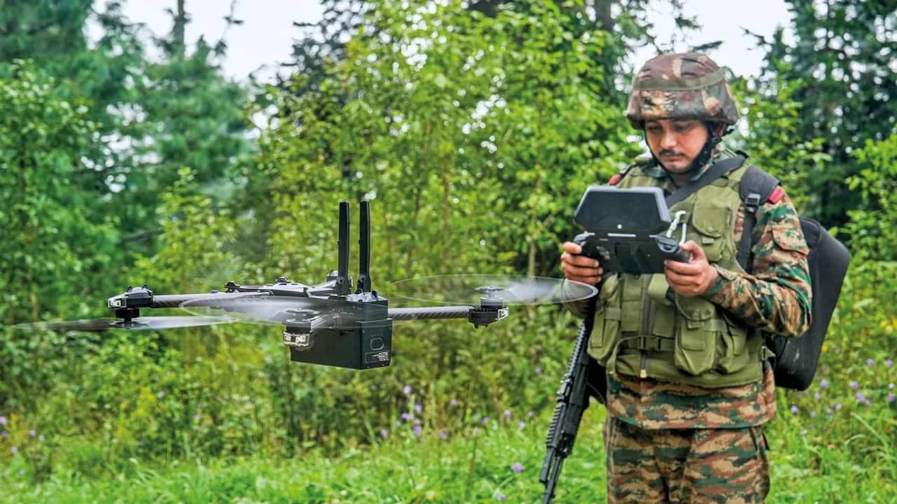 An Indian soldier operates a drone