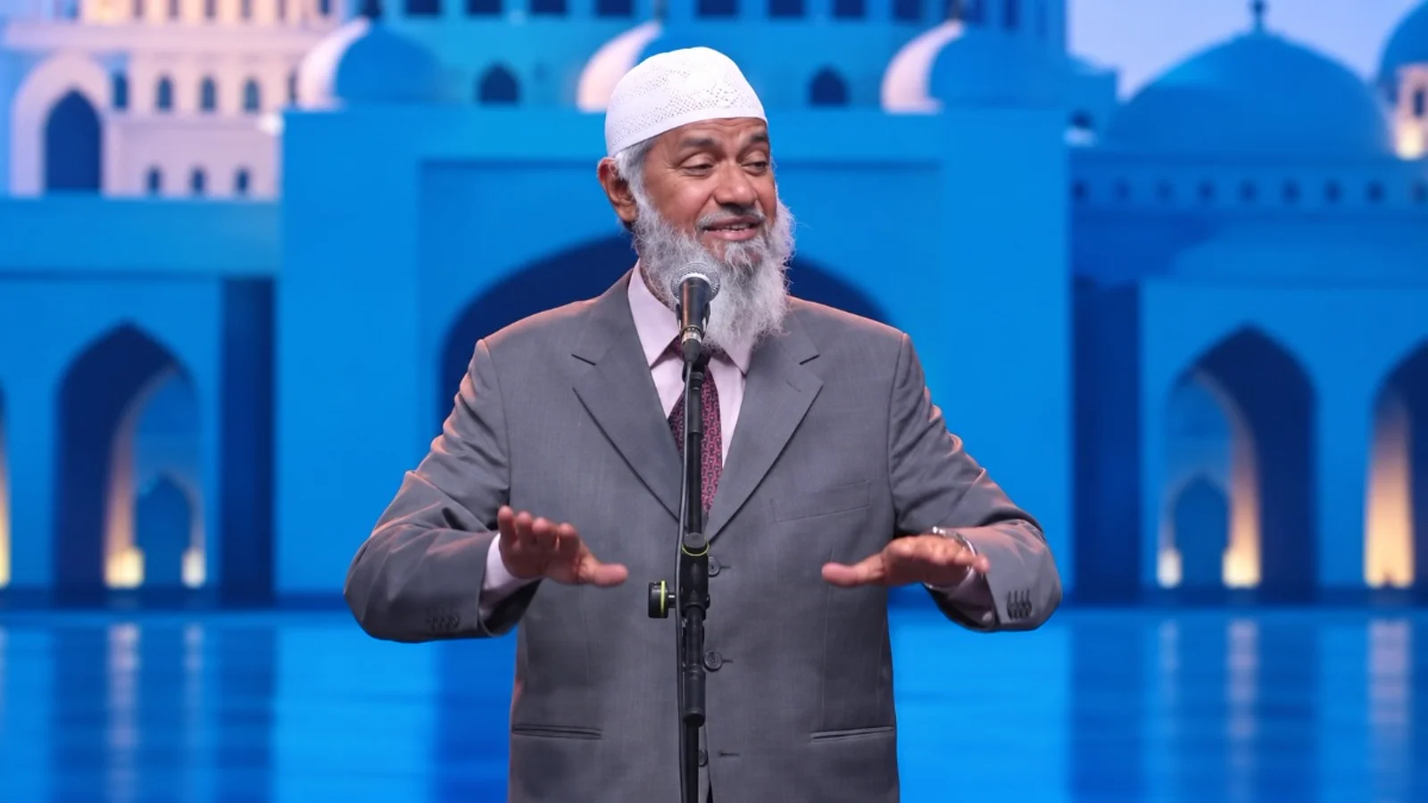 Zakir Naik speaking at an event.